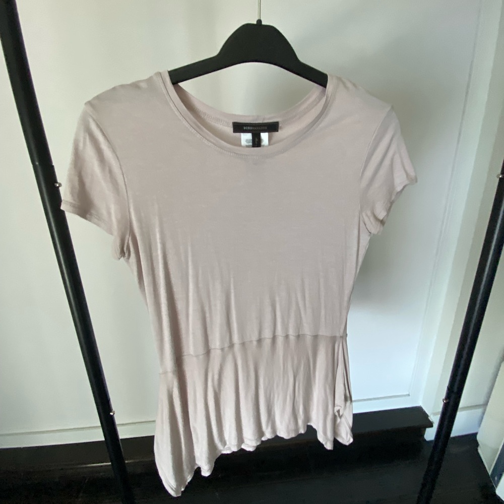 Woman’s asymmetrical top